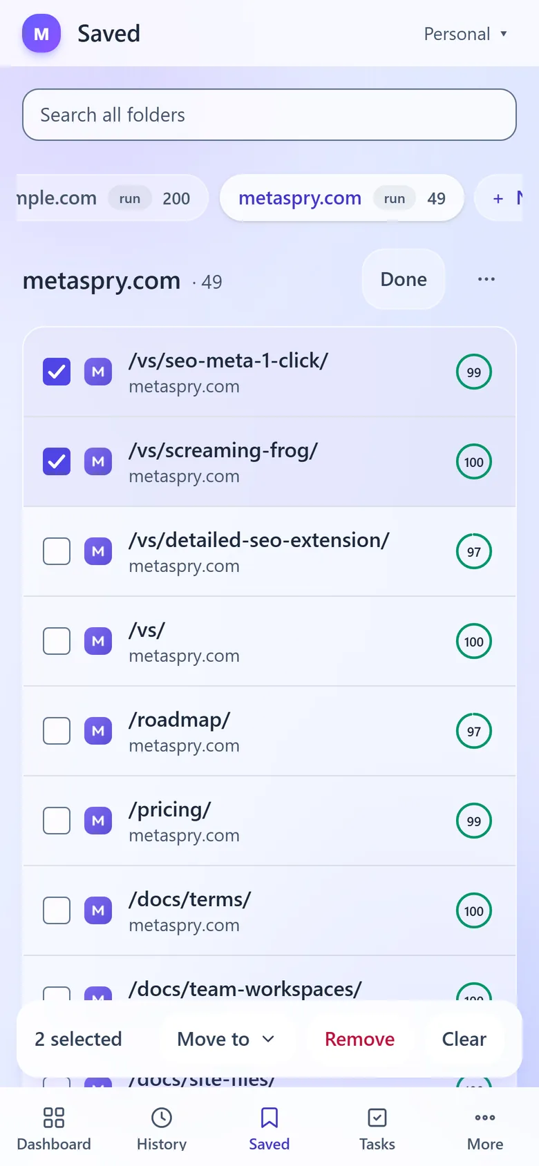 Web app Saved on a phone in selection mode: folder chips, two rows ticked and the bar with Move to, Remove and Clear above the tab bar